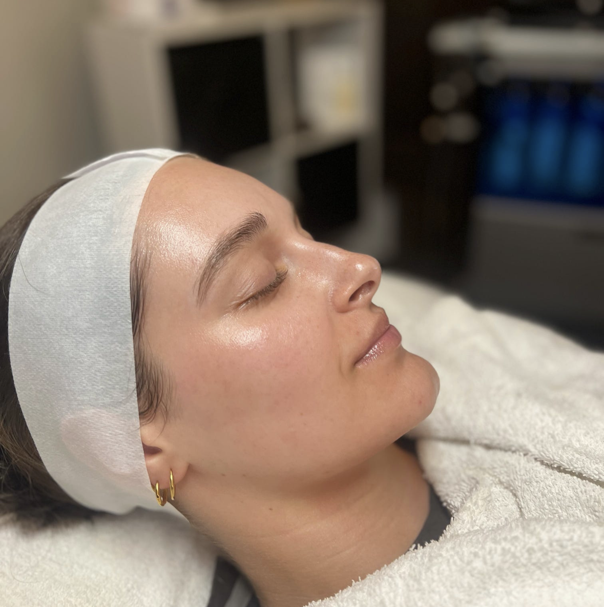A Shine Auburn guest relaxing after a facial treatment